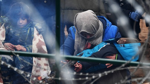 Geflüchtete in einem Flüchtlingslager nahe der belarussisch-polnischen Grenze
