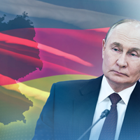 Russlands Präsident Putin vor einer Deutschlandflagge