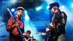 Bandmitglieder von The Rifles auf der Bühne 
