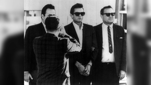 Johnny Cash wird in Handschellen abgeführt