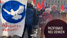 Teilnehmende der Großdemo der Friedensbewegung in Berlin am 03.10.2025. Auf einem Demonstrationsschild ist eine Friedenstaube abgebildet, darunter der Schriftzug "Abrüsten weltweit!". 
