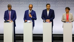 Markus Söder, Friedrich Merz, Lars Klingbeil und Saskia Esken bei der Koalitionsvertragsunterzeichnung