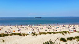 Menschen am Sandstrand