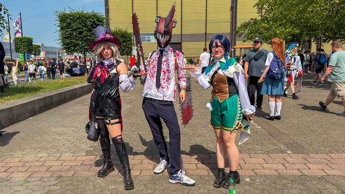 Drei Cosplayer auf der Messe Dokomi in Düsseldorf