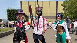 Drei Cosplayer auf der DoKomi in Düsseldorf