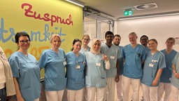 Klinikmitarbeiterinnen auf einem Gruppenbild