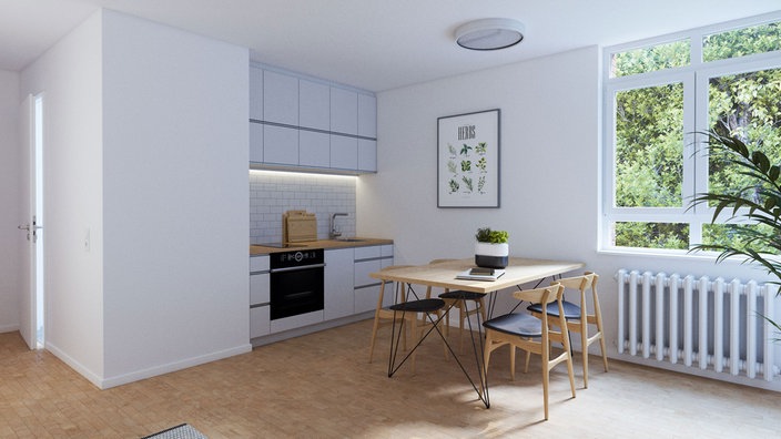 Auf dem Foto ist ein helles Studentenapartment mit einem Esstisch und kleiner Küche.
