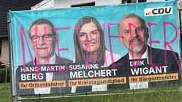 Schmiereien auf CDU-Wahlplakate