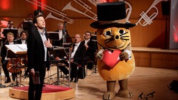 Die Maus und Moderator Johannes Büchs