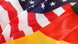 Symbolbild Deutsche und US-Amerikanische Flagge