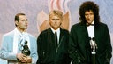 Die Mitglieder der Band "Queen" im Februar 1990 bei der Verleihung der BRIT Awards: Freddie Mercury, Roger Taylor and Brian May (v.l.)