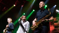 Drei Musiker auf der Bühne