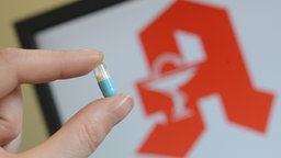 Pille mit Apotheken Logo