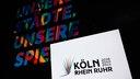 Das Logo ist beim Start der Kampagne für die Bewerbung der Region Rhein-Ruhr, mit Köln als "Leading City", um Olympische und Paralympische Spiele in der Lanxess-Arena zu sehen (19.01.2026).