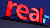Schriftzug Real Supermarkt 