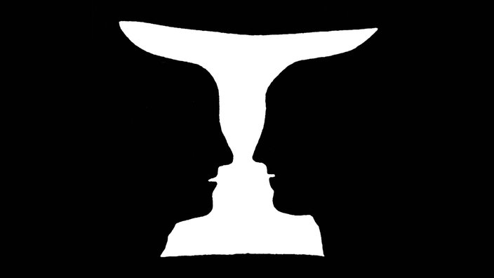 Das Kippbild des dänischen Psychologen Edgar Rubin zeigt sowohl eine Vase als auch zwei sich anschauende Gesichter