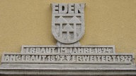 Oranienburg-Eden: Inschrift am Genossenschaftshaus 