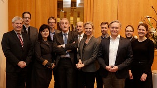 Gruppenfoto von 11 Personen
