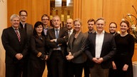 Gruppenfoto von 11 Personen