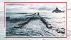 Die Überreste der Seebrücke Heringsdorf ragen aus den Meeresfluten