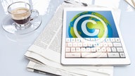 Zeitung, Touchscreen, Copyright im Web