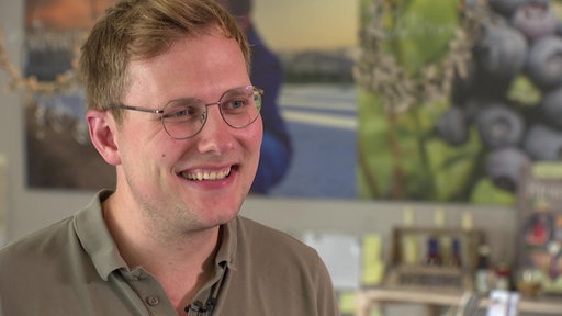 Nahaufnahme von Arne Hensegens, er lächelt.